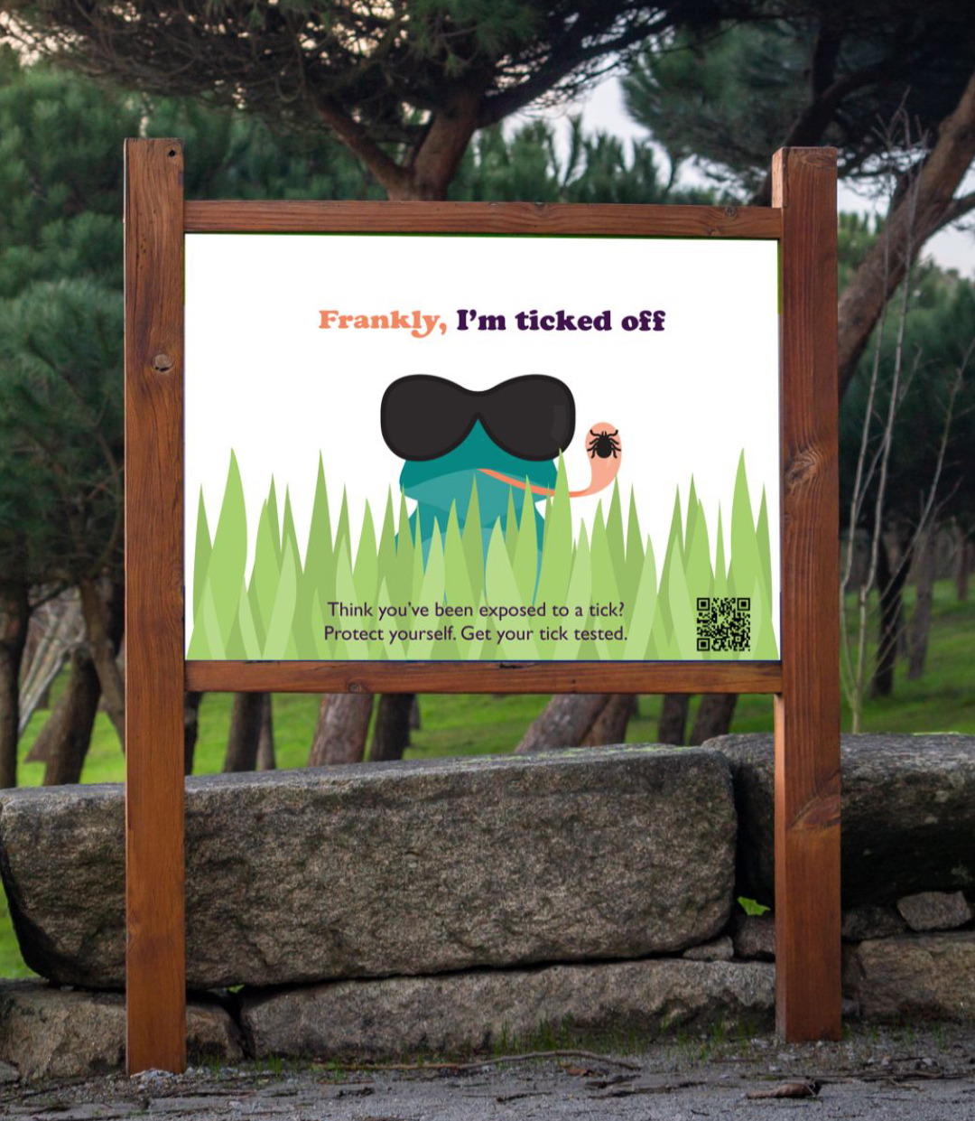 A photo of a sign that reads "Frankly, I'm ticked off. Think you've been exposed to a tick? Protect yourself. Get your tick tested." with an illustration of the Frankly frog mascot